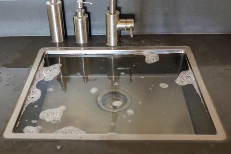Kitchen sink overflow due to the blocked drain